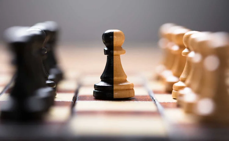 merger acquisition buy deal chess pieces
