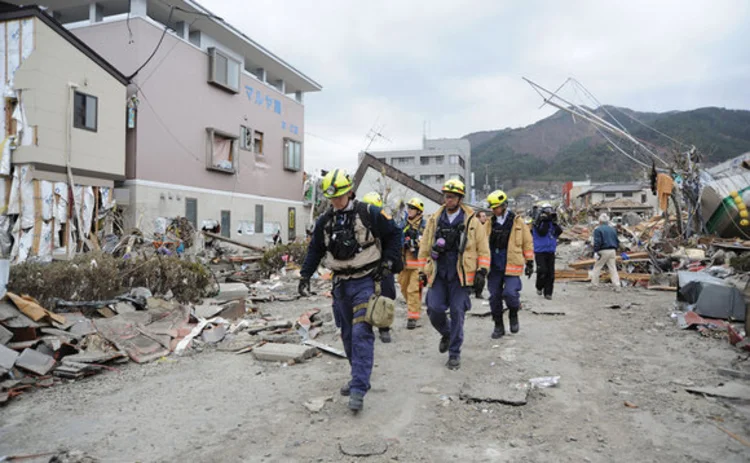 Members of Virginia Task Force 1 from the Fairfax County Fire and Rescue Department search for survivors in Ofunato Japan following an earthquake and subsequent tsunami