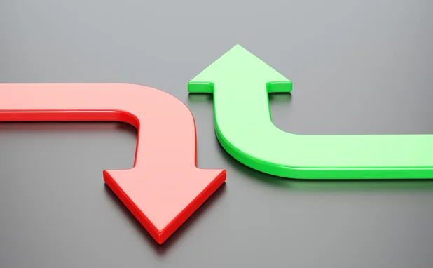 A red down and green up arrow side by side