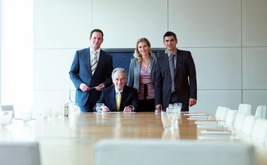 Men and woman in boardroom