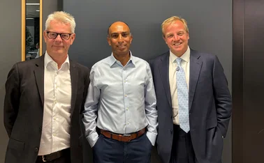 Stuart Reid (left) and Toby Clegg (right) with Vivek Banga