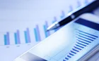 Close up of balance sheet charts and pen