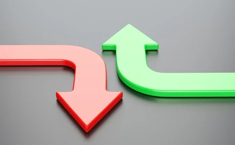 A red down and green up arrow side by side