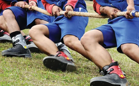 Tug of war team pulling on rope
