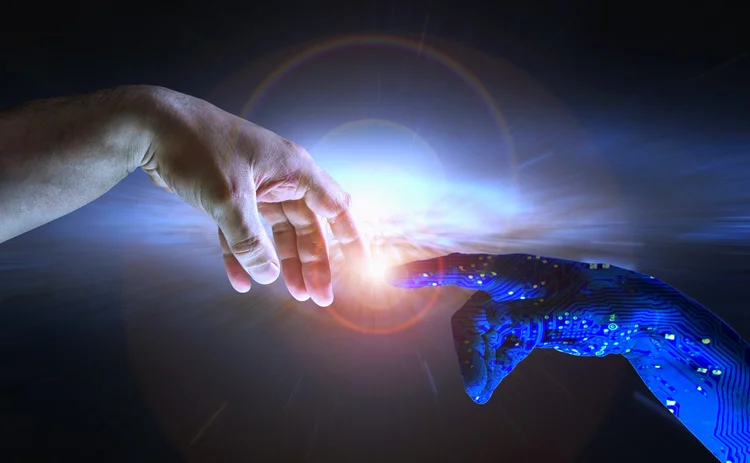 Human and robot hand touching fingers