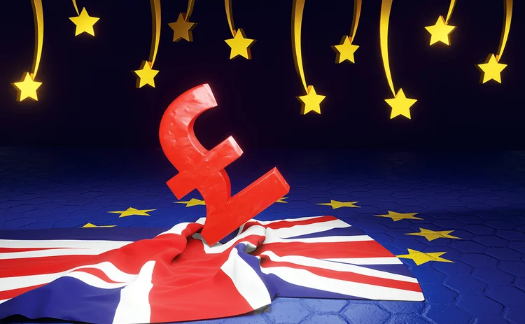Pound sign on British flag with EU background and falling stars