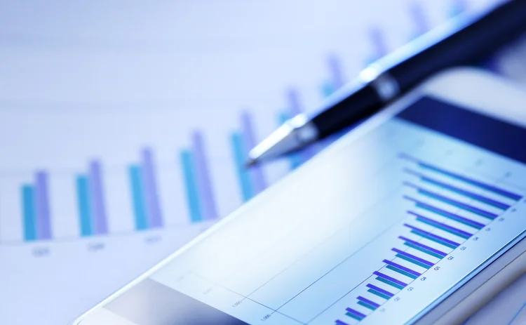 Close up of balance sheet charts and pen