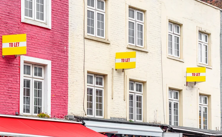 Colourful terraced houses with TO LET signs around Camden Town in London