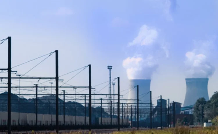 A view of cooling towers at a nuclear power plant in the distance