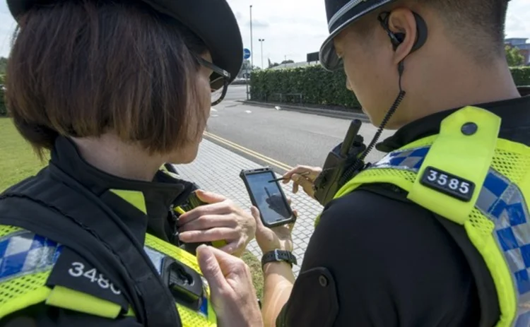police-officers-using-a-mobile-device-while-on-duty