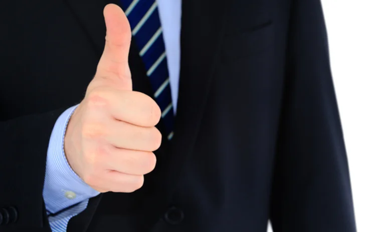 Positive thumbs-up businessman