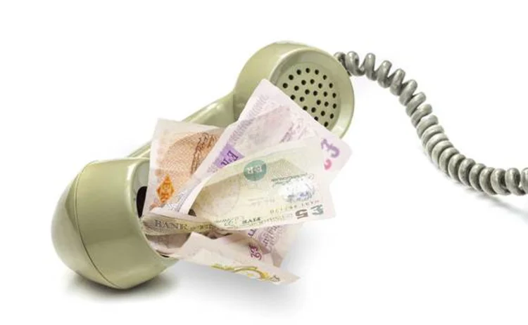 Money disappearing into telephone