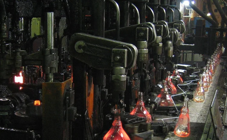 An assemply line manufacturing bottles