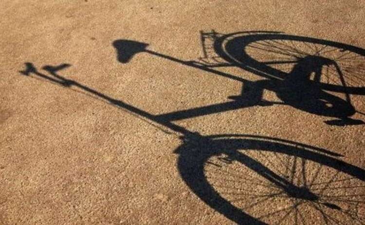 shadow-of-bicycle-on-tarmac