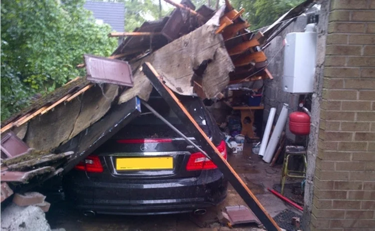 A car crushed in Belfast after severe flooding