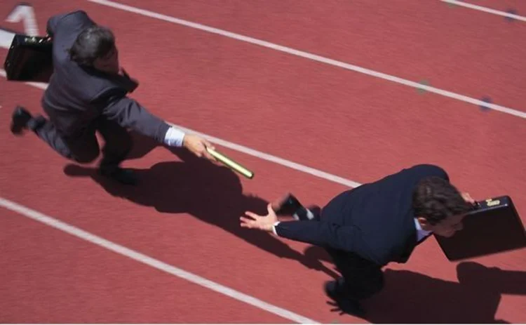 Businessmen in a relay race