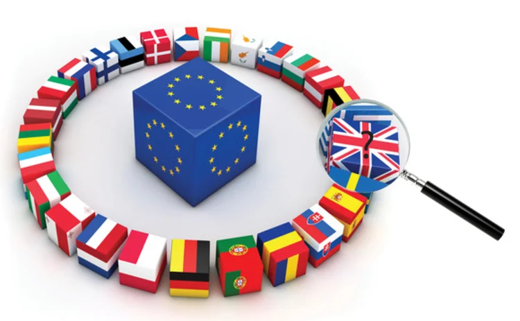 EU cubes with flags and magnifying glass over Britain