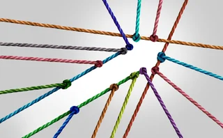 Several coloured strings are joined together creating the shape of a forward-pointing arrow