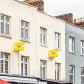 Colourful terraced houses with TO LET signs around Camden Town in London
